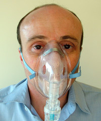 patient with nebuliser mask operating