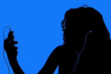 silhouette of teen with digital video player - obrazy, fototapety, plakaty