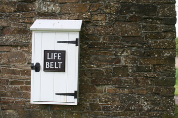life belt box on stone wall