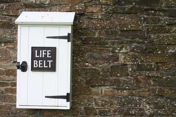 life belt box on stone wall