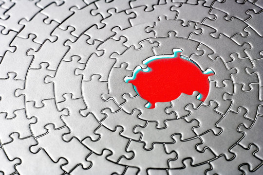 abstract of a silver jigsaw with missing pieces in the red cente