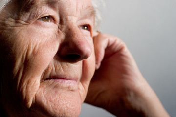 elderly woman contemplating