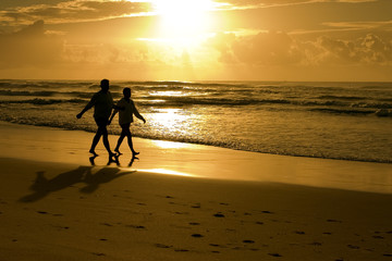 silhouette of a couple on beach