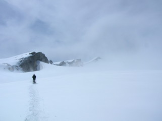 lonely climber descending in clouds