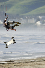kite skateboarder catching air