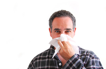 man with cold blowing nose