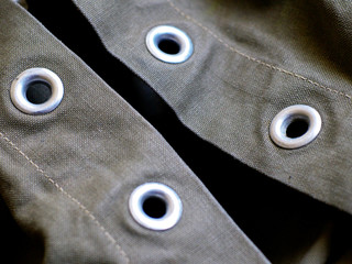 metal rivet ringlet eyes in heavy green canvas