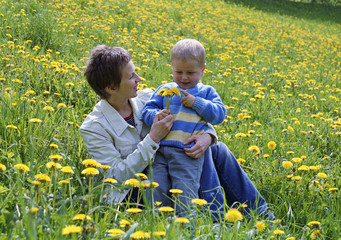 child and mother on a glade