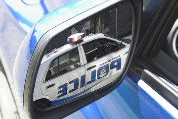 police car in mirror