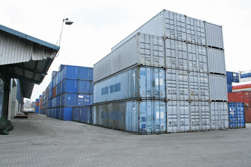 Containers stacked outside port warehouse