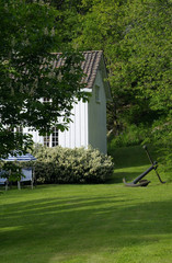 detail of old, white, wooden house in norway