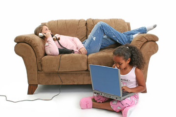 girls on couch, phone, laptop