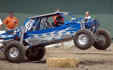 Foto op Canvas blue sand car leaping © Clarence Alford