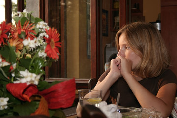 sad woman near window