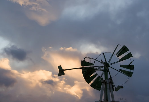 broken windmill and sunset