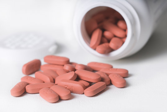 spilled pile of red tablets