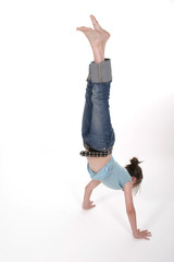 young pre teen girl performing a handstand 1