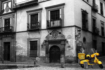 yellow scooter in alley