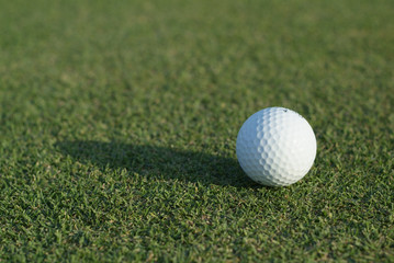 golf ball on green, close-up