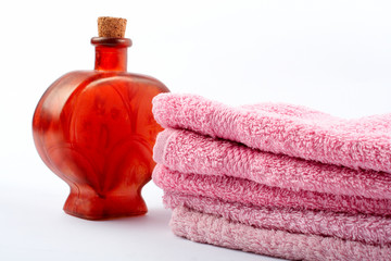 towels and fragrance bottle