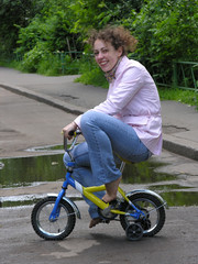 Fototapeta na wymiar girl on small bicycle
