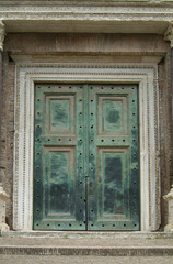heavy, green door in rome