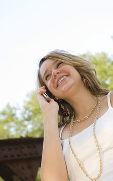 pretty teenage girl talking on mobile phone