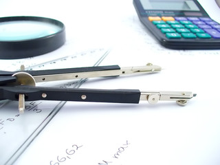 compasses and magnifying glass