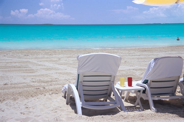 Fototapeta na wymiar chairs in the sand
