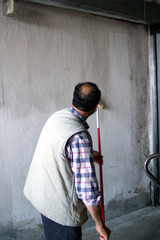 man painting the wall