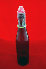 condom on beer bottle