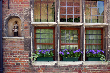 window boxes and religious statue