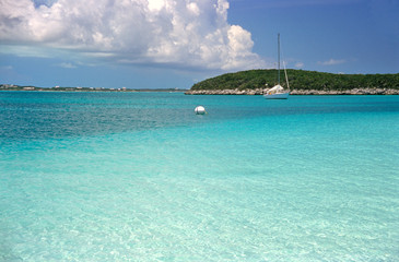 sailboat on the turquoise caribbean sea