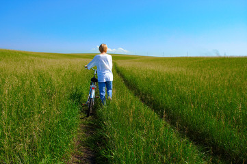 beauty girl  and bike in field