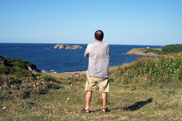 man looking at the island