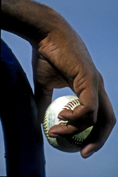 Black Hand Holding A Baseball