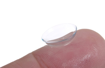 contact lens on finger on white background