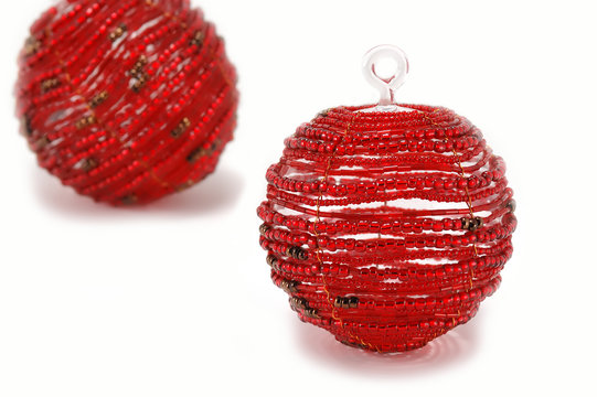 two red beaded christmas ball ornaments