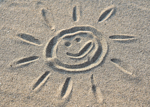 sun sign in sand