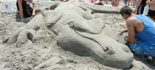 sand sculpture of a monster