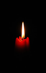 red candle on the black