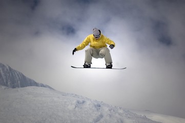 snowboarder jumping high in the air © jeffrey van daele