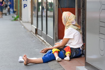 woman beggar asking for money in skopje, macedonia