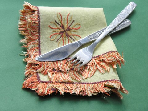 knife and fork on a serviette