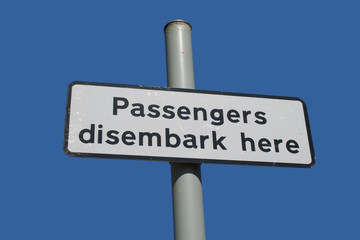 Obraz premium passenger disembark here sign