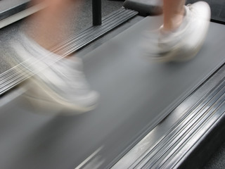 man running on treadmill - 1040442