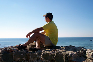 man watching black sea