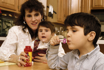 mom playing with kids at home