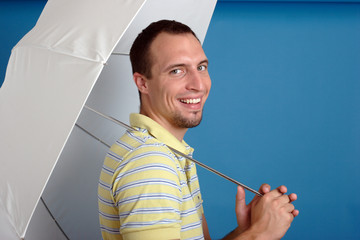 smiling young man with white umbrella