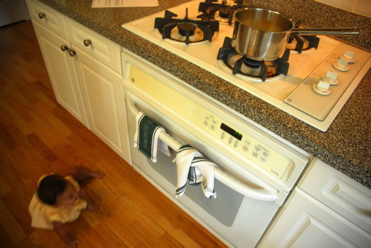 baby playing in kichen